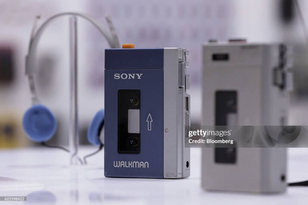 Inside The "It's A Sony" ExhibitionSony Corp. Walkman MDR-3 headphones, left, the company's first Walkman TPS-L2 portable stereo cassette player, center, and a TCM-100 cassette recorder sit on display at the "It's a Sony" exhibition in Tokyo, Japan, on Saturday, Nov. 12, 2016. The exhibition officially opens today and runs until Feb. 12, 2017. Photographer: Kiyoshi Ota/Bloomberg via Getty Images