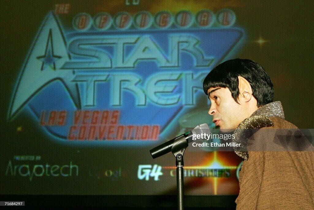 Star Trek Convention In Las Vegas - Day 4LAS VEGAS - AUGUST 20: Star Trek fan Luis Valentine of New York, dressed as a Vulcan character, asks actor Scott Bakula a question at the fifth annual official Star Trek convention at the Las Vegas Hilton August 20, 2006 in Las Vegas, Nevada. (Photo by Ethan Miller/Getty Images)