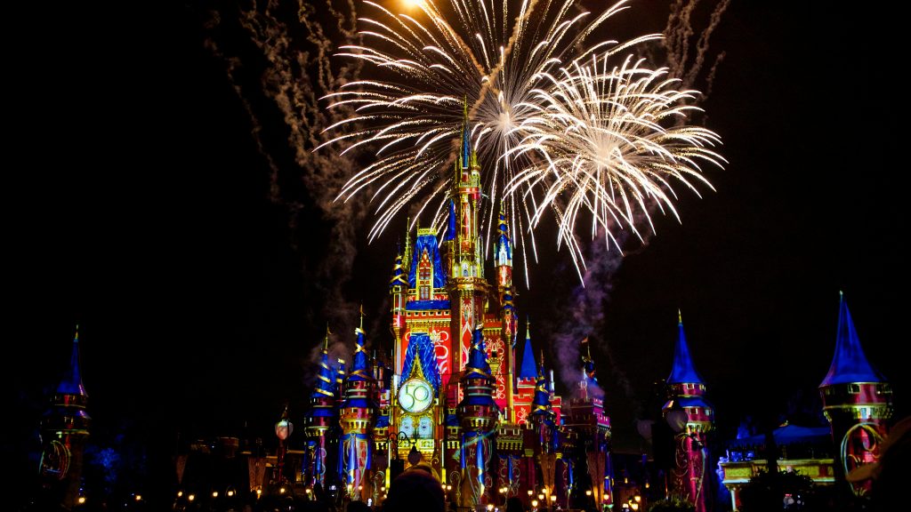 Walt Disney World. Image courtesy of Unsplash.com. https://unsplash.com/photos/a-castle-is-lit-up-with-fireworks-at-night-uPQiTOzYoo0