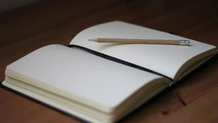Journal and pencil. This is the featured image for the article on journaling. Image courtesy of Unsplash.com. https://unsplash.com/photos/brown-pencil-on-white-book-page-fVUl6kzIvLg