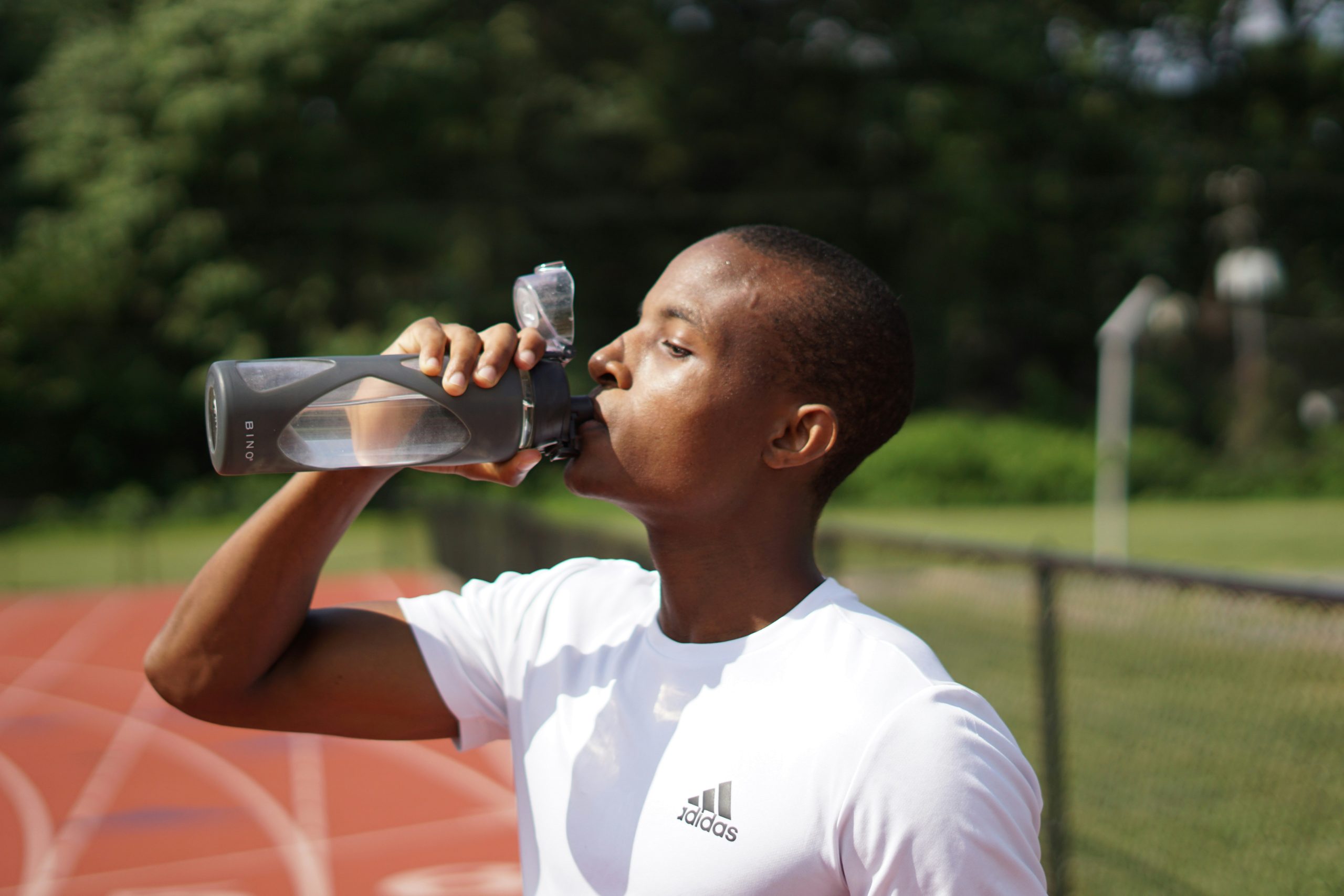 too much water: athlete sipping water
