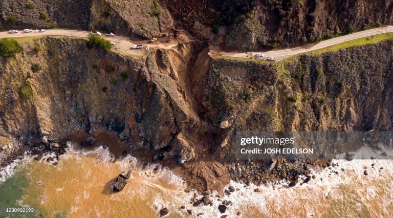 TOPSHOT - A section of Highway 1 is seen after it collapsed into the Pacific Ocean near Big Sur, California on January 31, 2021. - Heavy rains caused debris flows of trees, boulders and mud that washed out a 150-foot section of the road. (Photo by JOSH EDELSON / AFP) (Photo by JOSH EDELSON/AFP via Getty Images) Big Sur