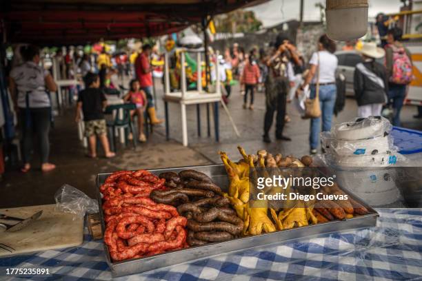foods in Colombia. SAN MARTIN, COLOMBIA - NOVEMBER 10: Traditional food from 'Los Llanos Colombianos' is displayed during 'San Martinidad parade' as part of the 56th Folkloric and Tourist International Festival of the 'llano' on November 10, 2023 in San Martin, Colombia. The 'Cuadrillas de San Martin' is an almost 300-years old tradition where the horsemen in San Martin show their skills in a contest with a series of 10 different games. It is not clear if the tradition comes from Spanish riders or from the Achagua indigenous, but the reason of the games was for fighting the territory between the Galanes, Moros, Guahibos and Cachaceros cultures, representing (in the same order) the Spanish, Arabs, indigenous and Africans. Today, is one of the most recognized cultural expression around and abroad Colombia.