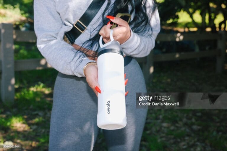 owala Water bottle brands Los Angeles, CA - January 08: Denai Blackshire poses for a portrait with her Owala branded water bottle at Runyon Canyon on Monday, Jan. 8, 2024 in Los Angeles, CA. She was gifted the bottle and uses it while exercising. (Dania Maxwell / Los Angeles Times via Getty Images)