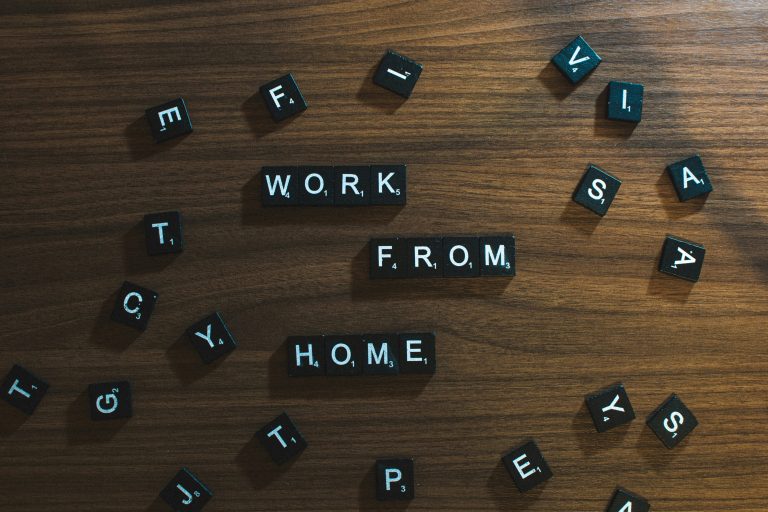 A repetitive image of 'work from home' text on a computer screen, symbolizing remote work opportunities.