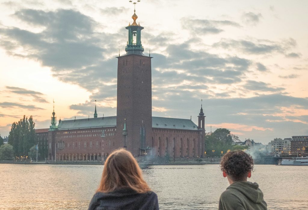 solo travel: man and woman enjoying view in Sweden