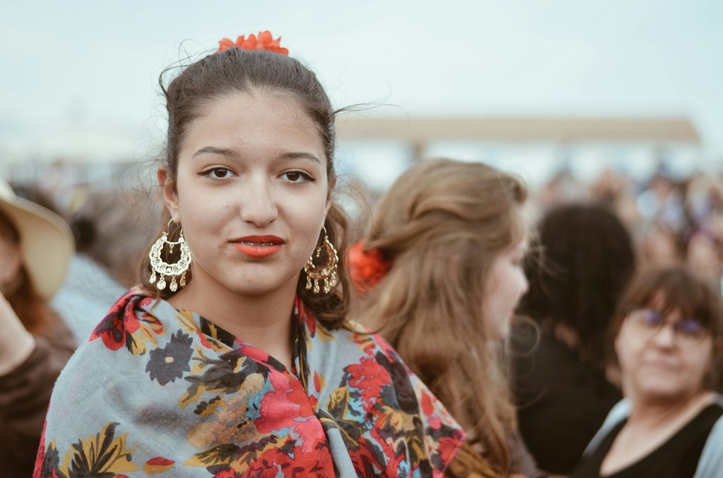 Woman looking at the camera. Image courtesy of Unsplash.com. https://unsplash.com/photos/smiling-woman-in-blue-red-and-white-floral-shirt-vGacDiUiD7I