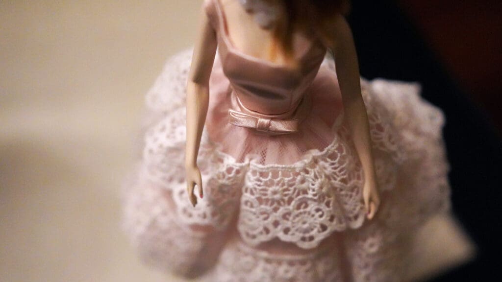 Barbie in a dress. Image courtesy of Unplash.com. https://unsplash.com/photos/close-up-of-female-doll-wearing-pink-and-white-dress-3LCYLyf0jHA