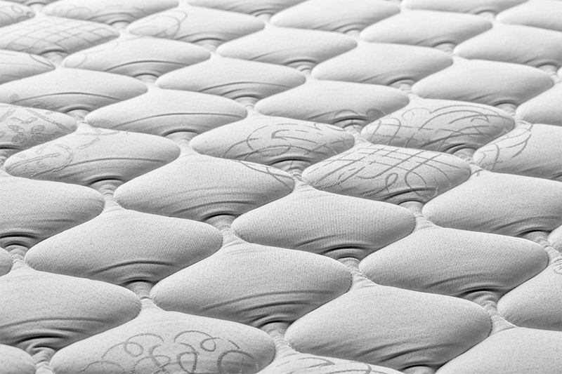 Closeup of an uncovered mattress.