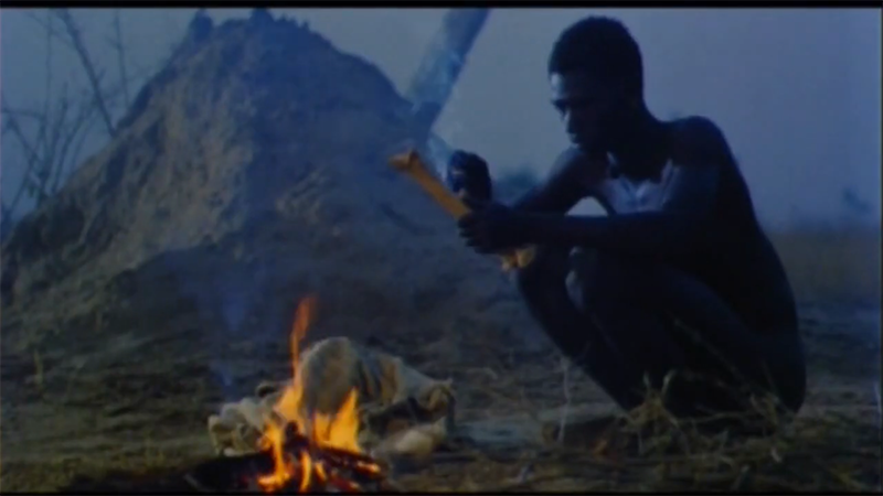 Nianankoro, the protagonist of Yeelen, carving a bone over a fire.