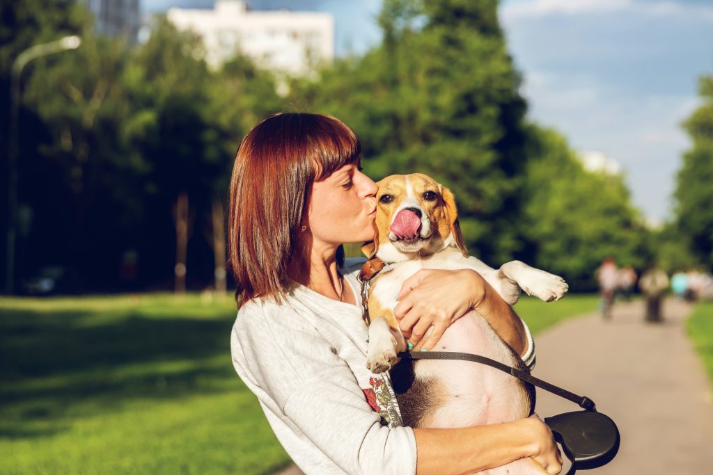 Woman and her dog. Photo by Artem Beliaikin on Unsplash. https://unsplash.com/photos/woman-carrying-and-kissing-dog-c6jp6Wmsjrk