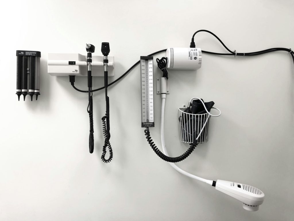 Exam Room at Doctor's Office courtesy of https://unsplash.com/photos/a-hair-dryer-and-a-hairdryer-on-a-wall-Z3fXPuxa15k