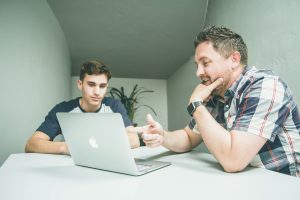 Parenting Coach 3 Reasons courtesy of https://unsplash.com/photos/man-wearing-white-and-black-plaid-button-up-sports-shirt-pointing-the-silver-macbook-y_6rqStQBYQ