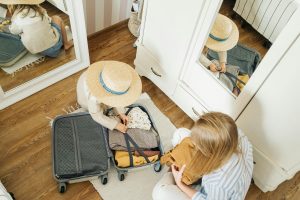 Woman and Child Packing for a Family Vacation courtesy of Ivan Samkov 