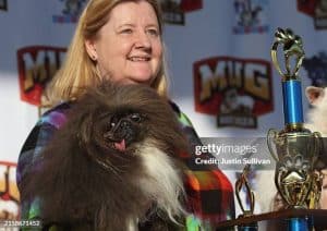 PETALUMA, CALIFORNIA - JUNE 21: Ann Lewis holds her dog Wild Thang after winning the World's Ugliest Dog contest at the Marin-Sonoma County Fair on June 21, 2024 in Petaluma, California. A Pekingese dog named Wild Thang won the 34th annual World's Ugliest Dog contest and was awarded $5,000. (Photo by Justin Sullivan/Getty Images)