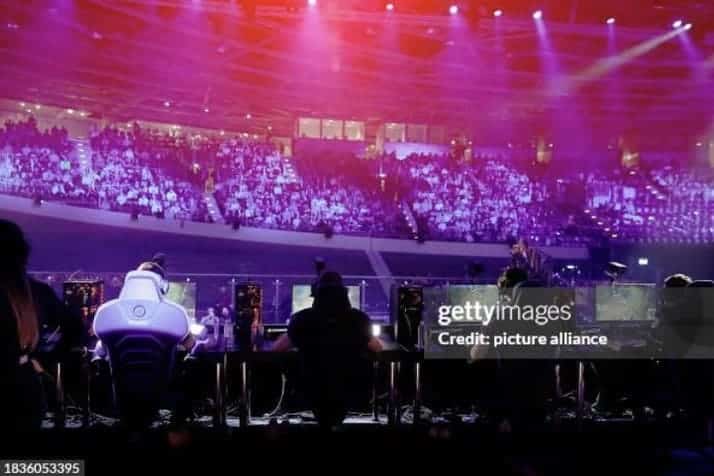 League of Legends Worlds Tournament 2023 showing the crowd in their seats from behind the players.