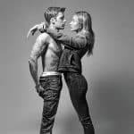 Justin Bieber held tightly by wife.