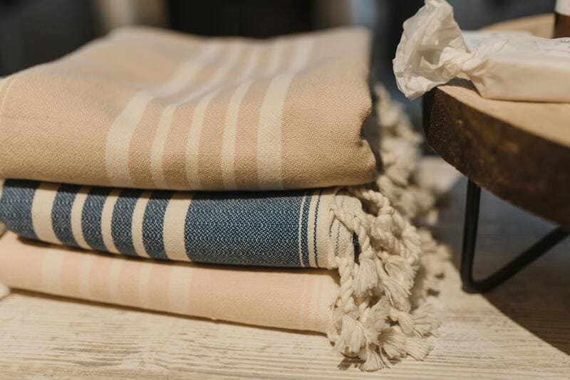 linens courtesy of https://s://www.pexels.com/photo/stack-of-blankets-placed-on-wooden-table-5424905/