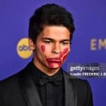 2024 Emmy nominee D'Pharaoh Woon-A-Tai wearing a red handprint painted over his mouth.