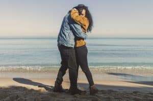 second chance love (a couple embracing during a reunion)