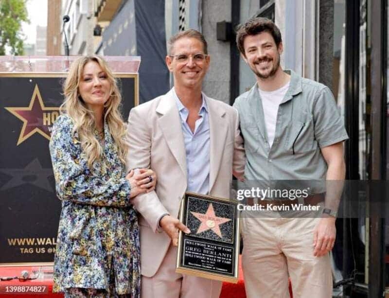 Kaley Cuoco, Greg Berlanti, and Grant Gustin pose as Greg Berlanti is honored with a star on the Hollywood Walk of Fame on May 23, 2022 in Hollywood, California. (Photo by Kevin Winter/Getty Images)