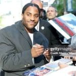 Denzel Washington's son Malcolm signing autographs at the premiere of The Piano Lesson. (Credit: Monica Schipper / Getty)