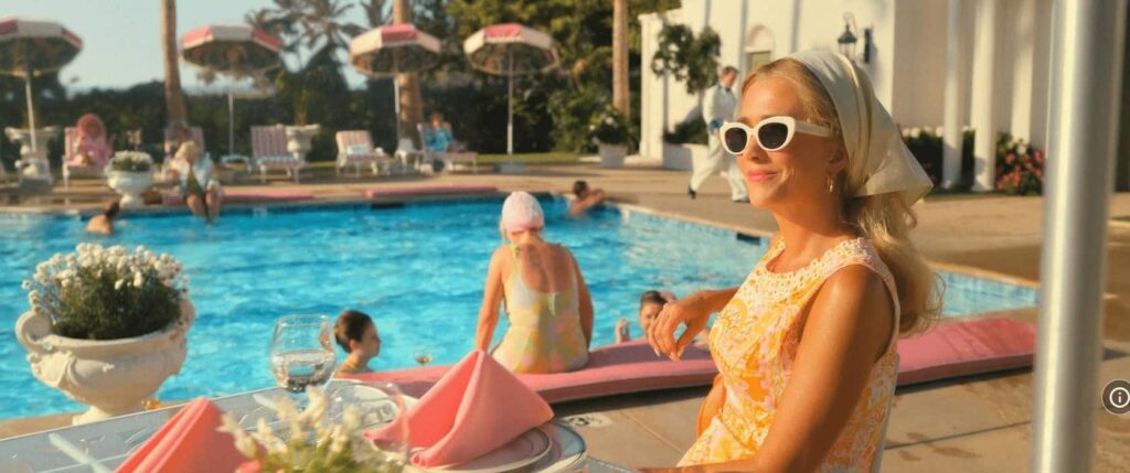 Kristen Wiig in a stylish scene from Palm Royale, a vibrant comedy-drama show.