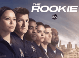 The main cast of The Rookie, including Nathan Fillion, in their police uniforms.