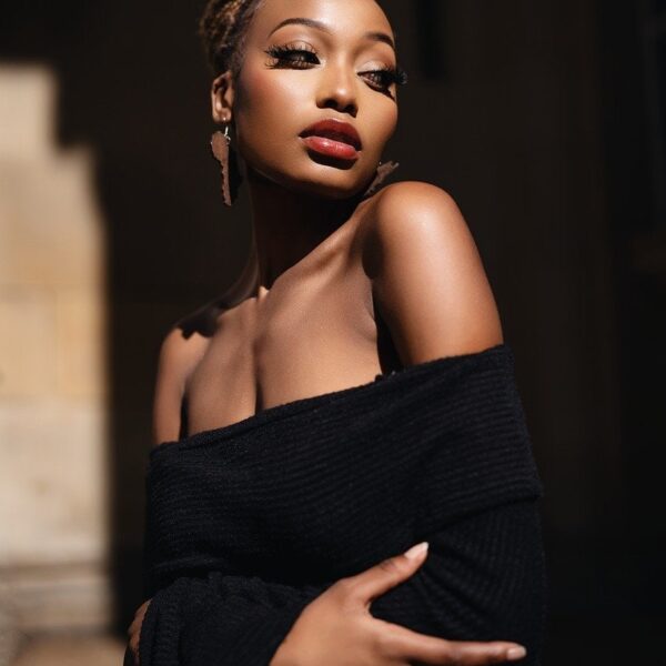 Inclusive fashion meets street style in this urban editorial shot, featuring a bold, gender-neutral outfit with sleek, minimalist flair and moody elegance.