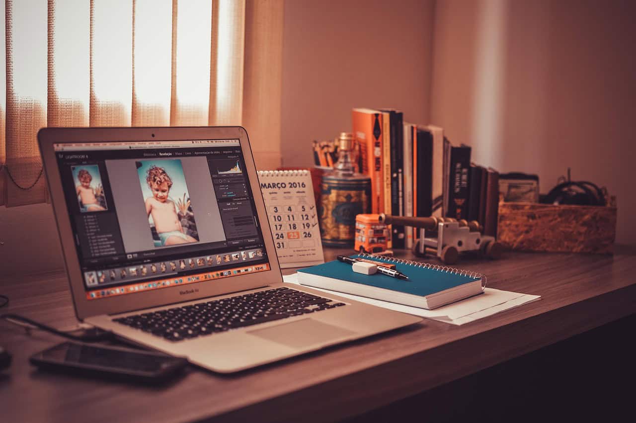 Modern home office workspace with a laptop, notebook, and desk setup—ideal for freelance work, remote jobs, and a productive work from home routine. Image credit: by Pexels via Pixabay
