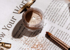 Close-up of a gold glitter eyeliner makeup brush applying sparkling gold powder, showcasing cosmetics and fashion beauty tools—perfect for beauty travel essentials. Image credit: AdoreBeautyNZ via Pixabay.