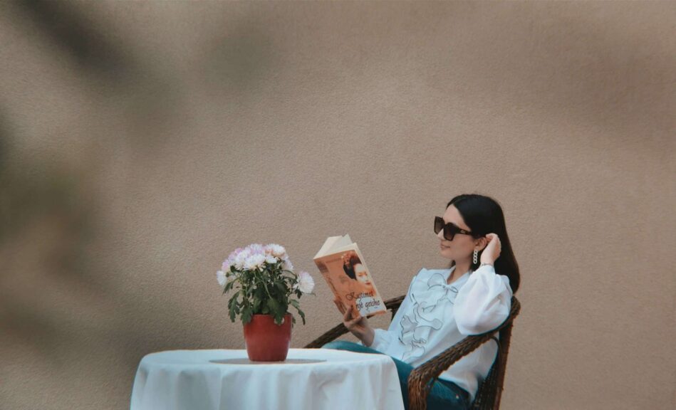 Solo date, a person sitting at a table reading a book