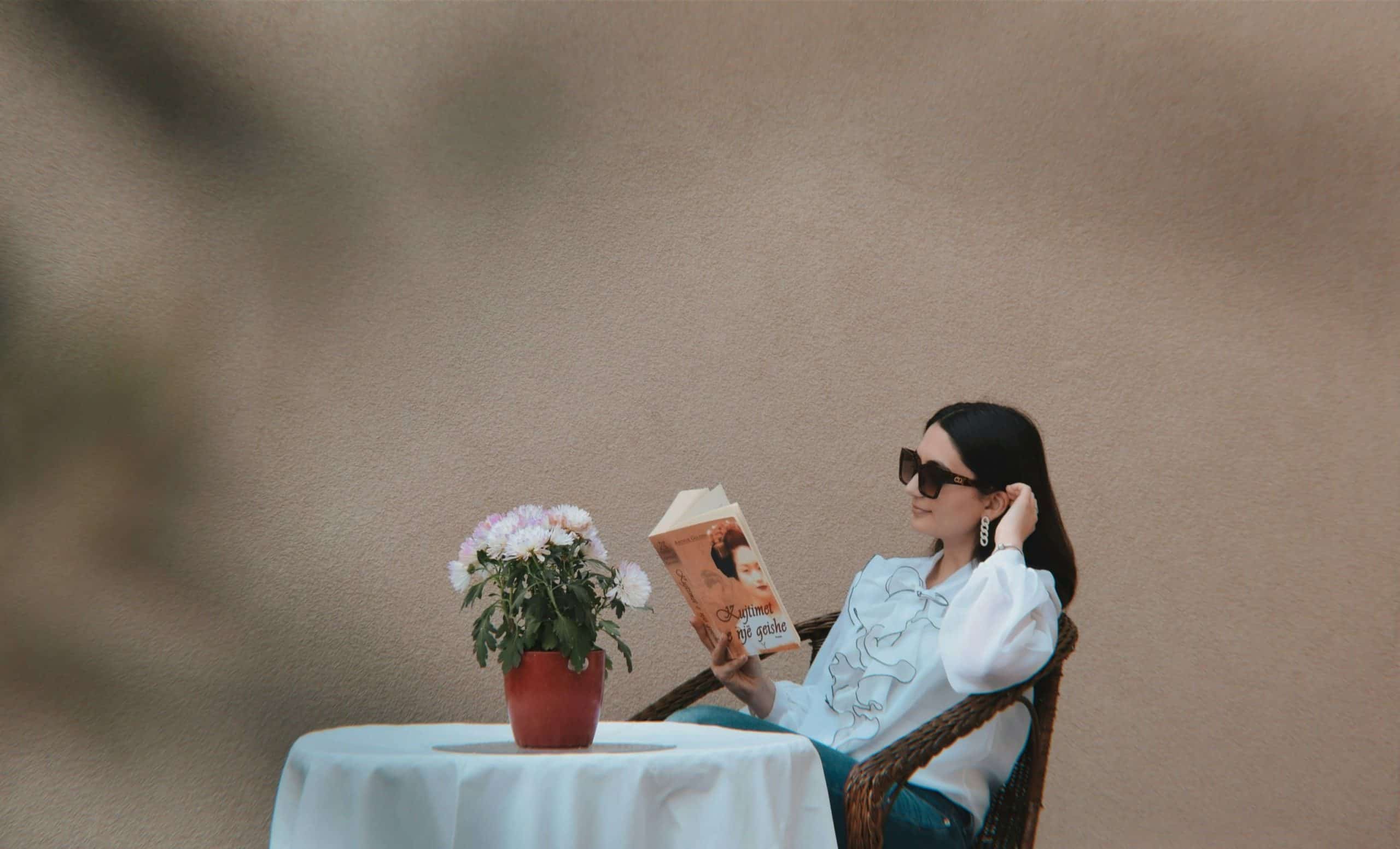 Solo date, a person sitting at a table reading a book