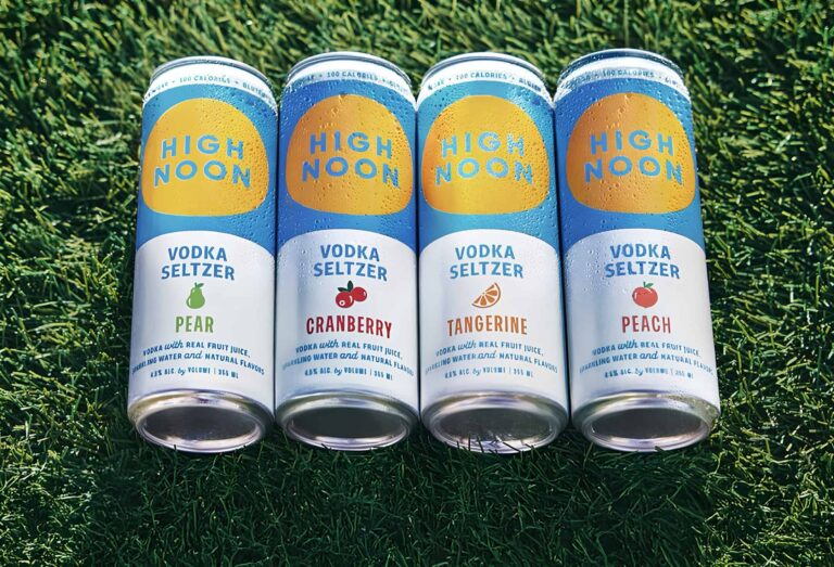 screenshot of the promotional image of four high noon flavors laying on green grass