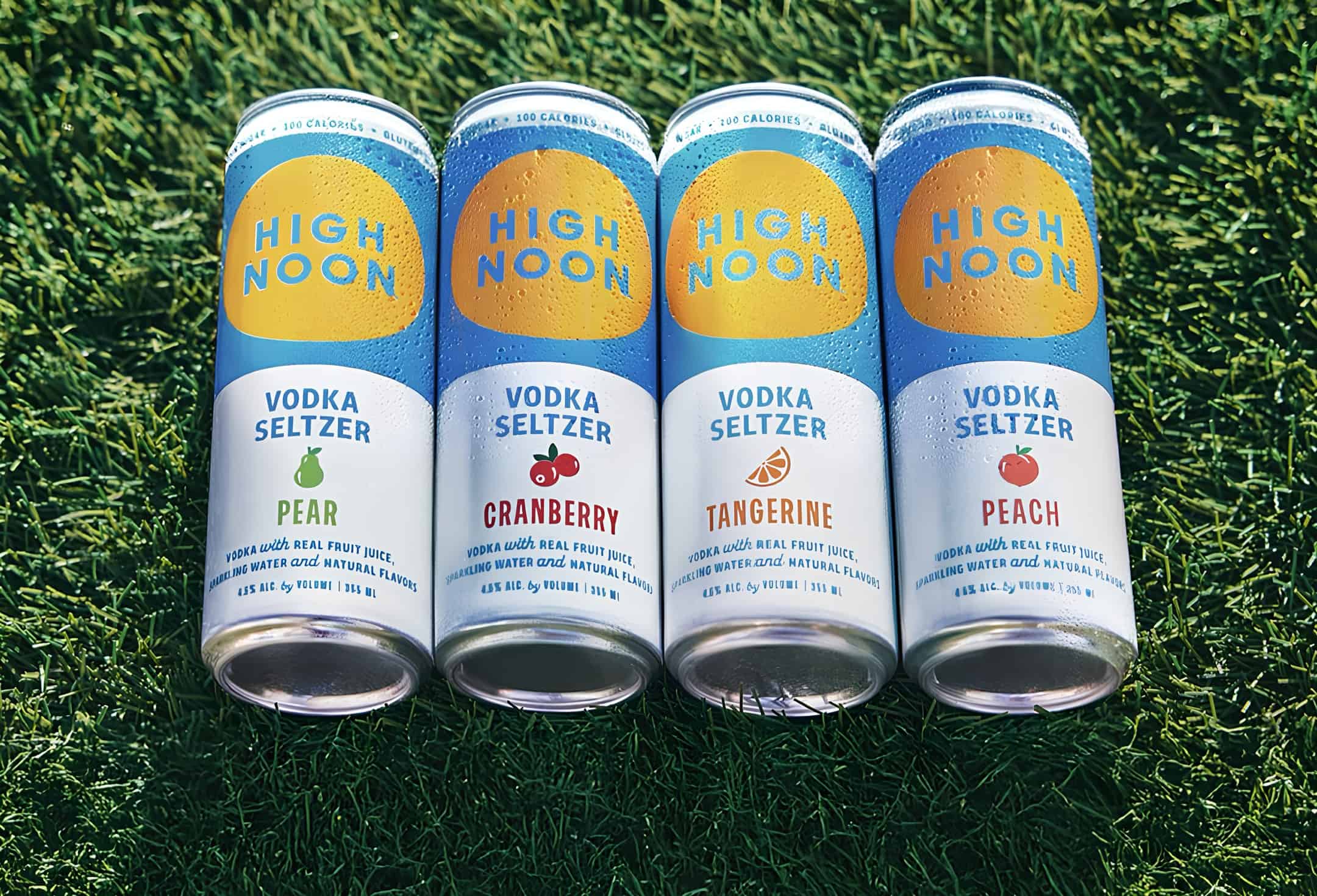 screenshot of the promotional image of four high noon flavors laying on green grass