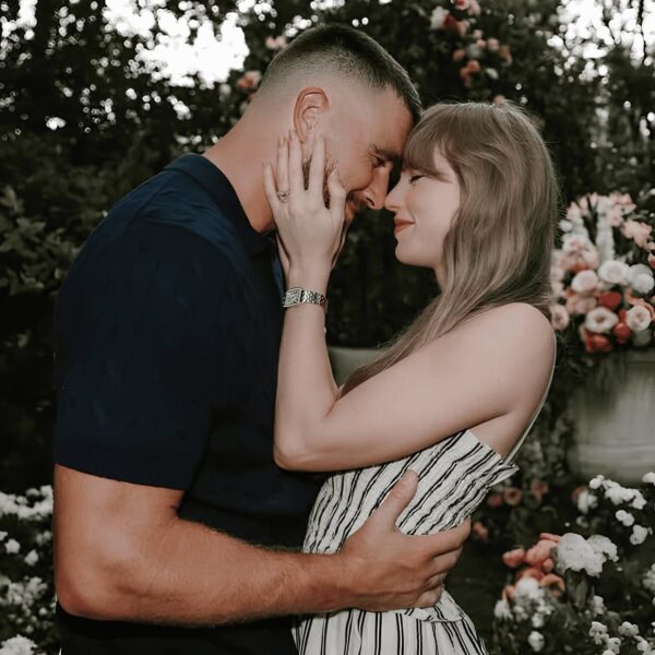 Taylor Swift and Travis Kelce engagement photo. Engagement nails.