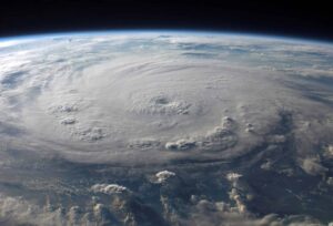 A stunning aerial view of Earth with a massive swirling hurricane, highlighting meteorological beauty. Hurricane-proofing