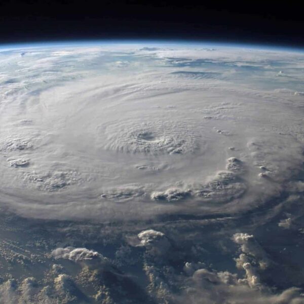 A stunning aerial view of Earth with a massive swirling hurricane, highlighting meteorological beauty. Hurricane-proofing