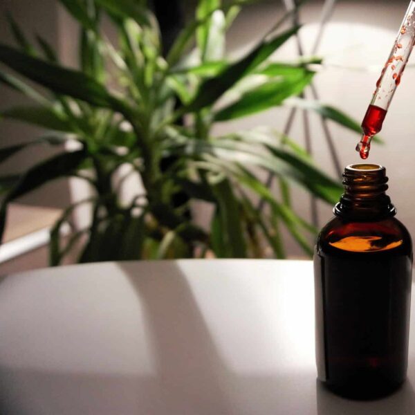 Vitamin B12 nutritional supplement in a laboratory vessel with a pipette, highlighting B12 research and supplementation. Photo by MarcOliver_Artworks via Pixabay.