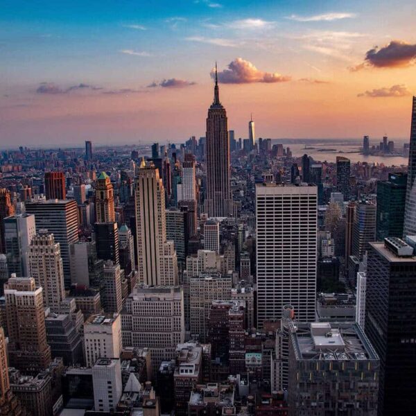 This is a photograph of New York City buildings. New York City can be included in a discussion of travel spots for families.
