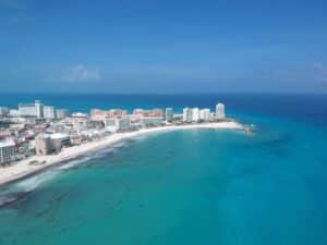 Discover the vibrant turquoise waters and pristine beaches of Cancun's iconic shoreline. Caribbean tourism