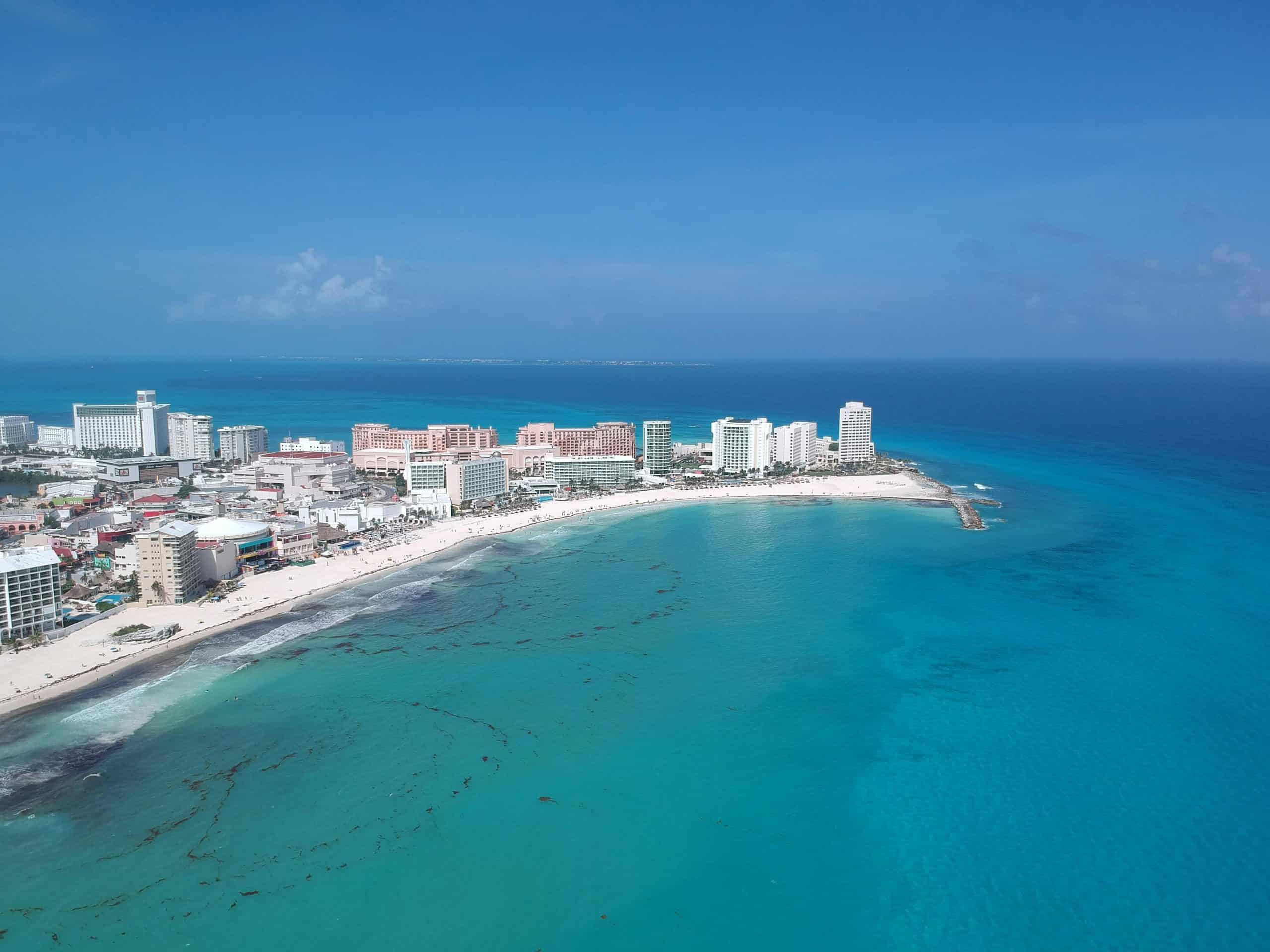 Discover the vibrant turquoise waters and pristine beaches of Cancun's iconic shoreline. Caribbean tourism