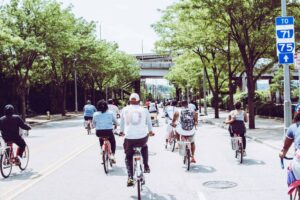 Cyclists enjoying a group ride on a sunny day in downtown Cincinnati. commuter bikes