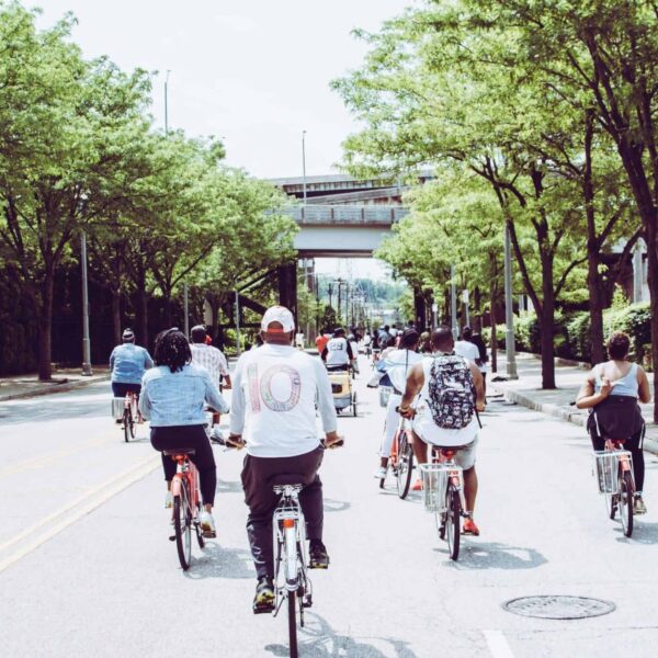 Cyclists enjoying a group ride on a sunny day in downtown Cincinnati. commuter bikes
