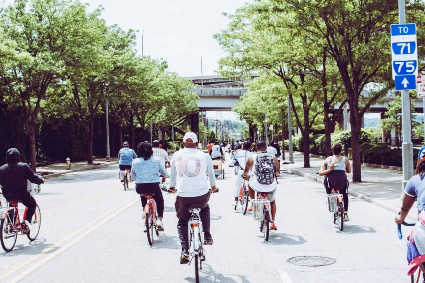Cyclists enjoying a group ride on a sunny day in downtown Cincinnati. commuter bikes