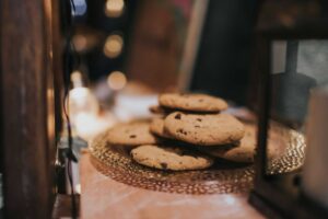 Close-up of freshly baked chocolate chip cookies on a decorative tray, ready to enjoy. Chocolate Chip Cookie Day