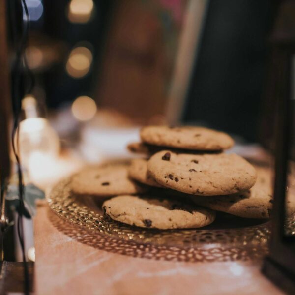 Close-up of freshly baked chocolate chip cookies on a decorative tray, ready to enjoy. Chocolate Chip Cookie Day