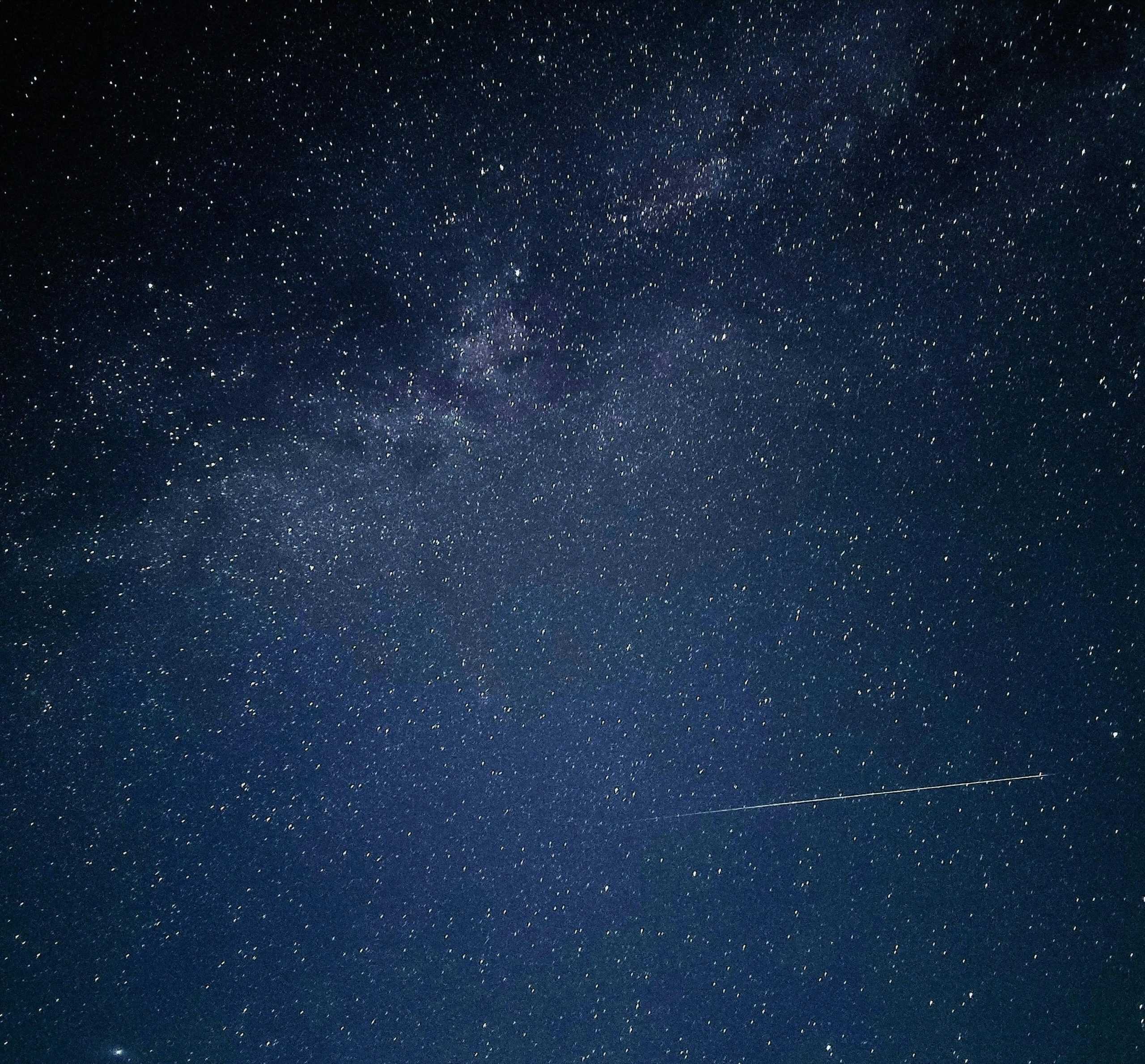 Star-filled night sky with a meteor streaking overhead—capturing the celestial motion that Sidereal Time helps track. Image by Em Hopper via Pexels.