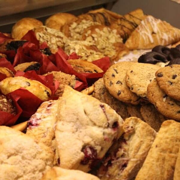 After-School snack, A delicious assortment of baked goods including cookies, muffins, and pastries ideal for breakfast or snack.