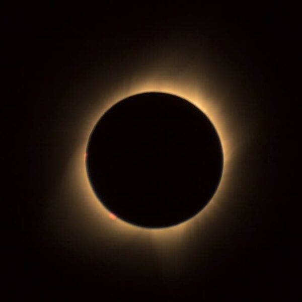 A captivating view of a solar eclipse highlighting the glowing corona in a dark sky.